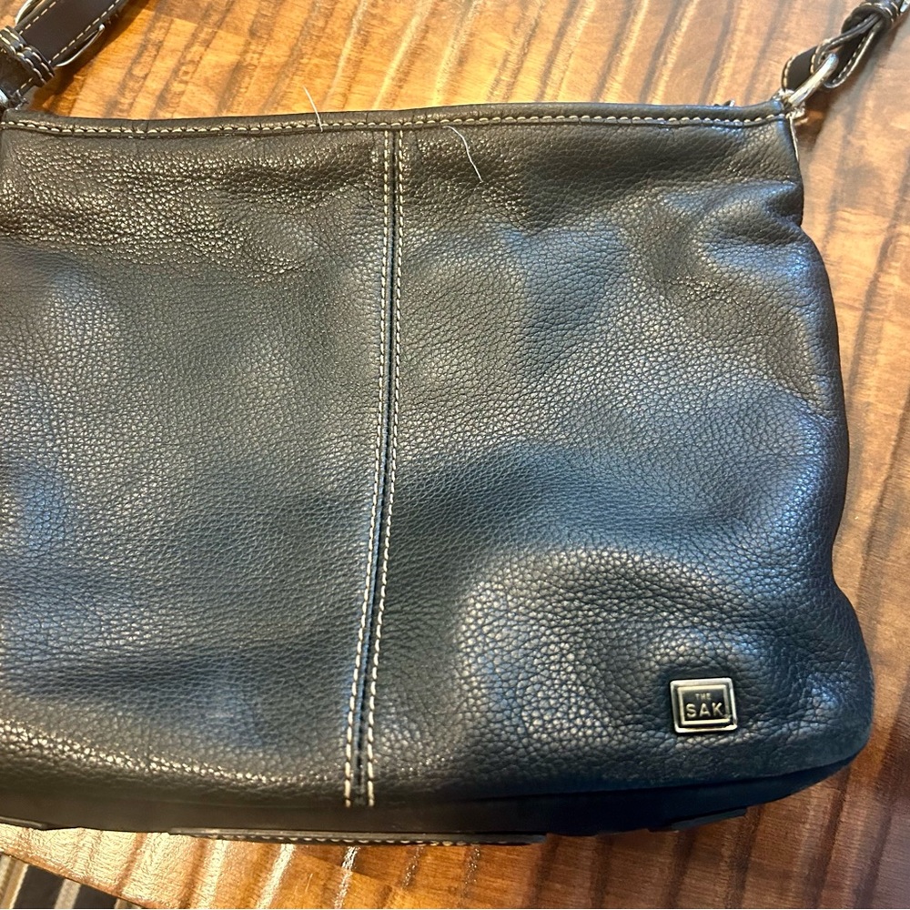 The sack. Shoulder bag, soft, black pebble, leather zip closure.